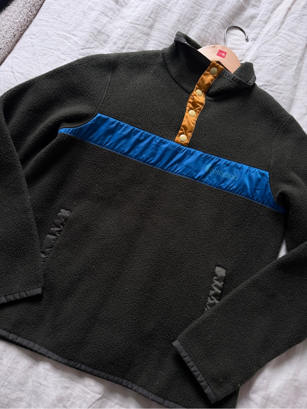 Cotopaxi Olive Fleece Pullover with Blue Chest Stripe and Gold Snap Placket